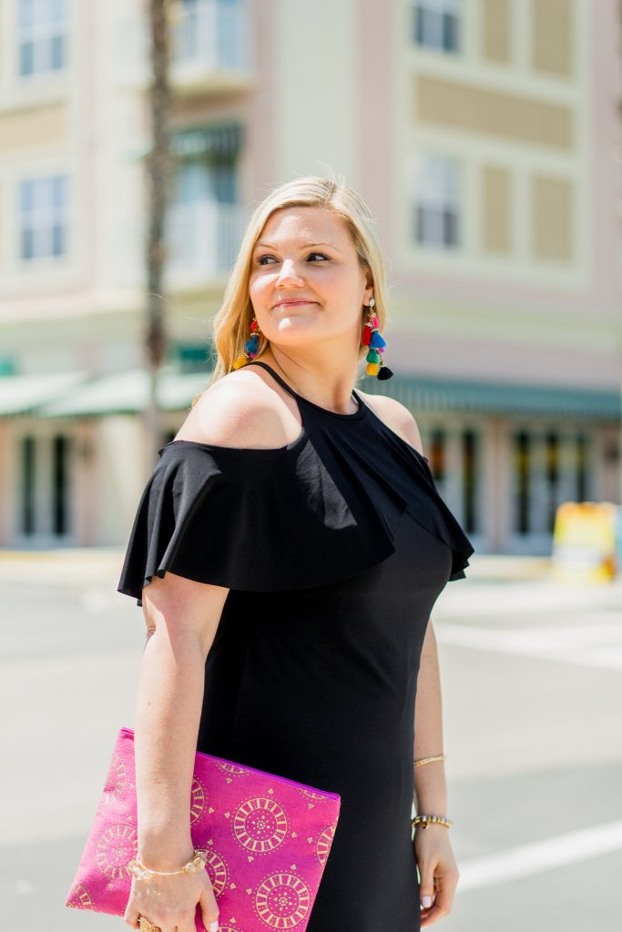 Black Dress and Pink Shoes Outfit featured by top Orlando fashion blog, Fabulously Overdressed: image of a woman wearing a Ross off the shoulder black dress and pink shoes.