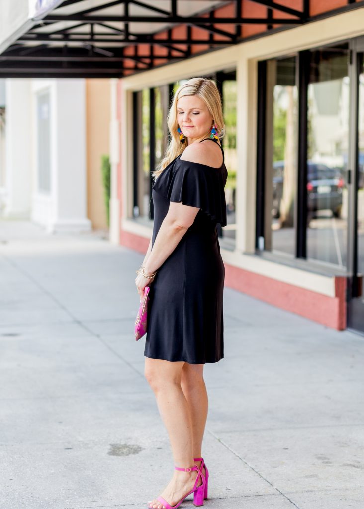 black dress and pink shoes