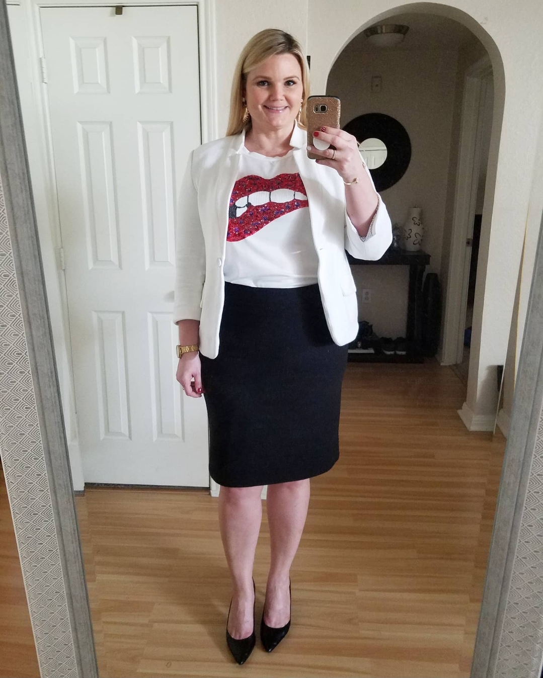 Orlando Fashion Blogger Emily of Fabulously Overdressed shares 5 ways to style a graphic tee Emily of Fabulously Overdressed shows how to wear a graphic tee to work: lips tee with white blazer and black pencil skirt.